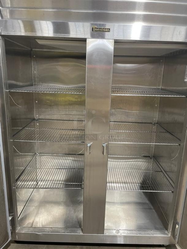 Traulsen Spec-Line stainless steel 2-door reach-in freezer, Model RLT232WUTFHS, with chrome wire racks, on casters.