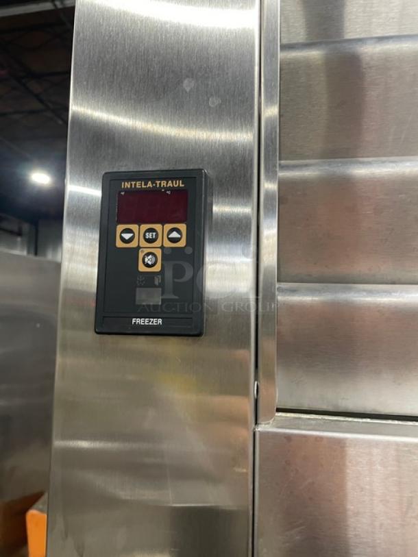 Traulsen Spec-Line stainless steel freezer, model RLT232WUTFHS, with control panel and chrome wire racks, on casters.