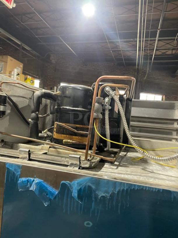 Traulsen Spec-Line Series commercial freezer, model RLT232WUTFHS, stainless steel, solid 2-door, on casters, with chrome wire racks.