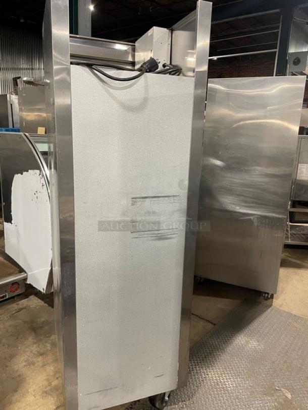 Traulsen stainless steel commercial hot food merchandiser, model AW132NX0001, single glass swing door, on casters.