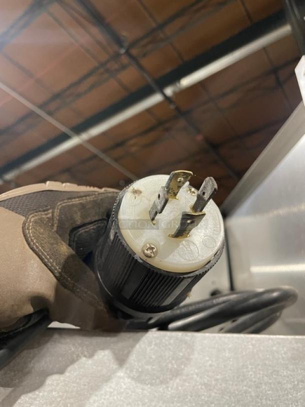 Traulsen commercial holding cabinet power plug shown, model AW132N-X0001, 208/115V, single-phase, durable design.