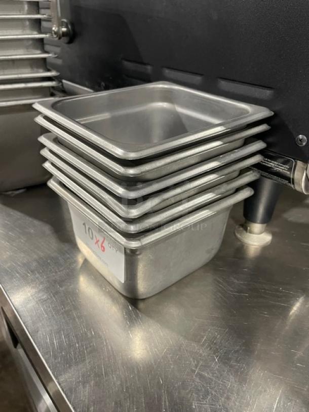 Stack of commercial stainless steel hotel/steamtable pans. Includes six pans per bid. Appears in excellent condition.
