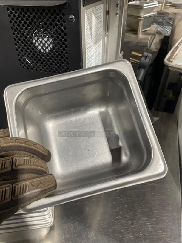 Commercial stainless steel hotel steamtable pan, durable, slightly used condition, sleek design, ideal for food service.
