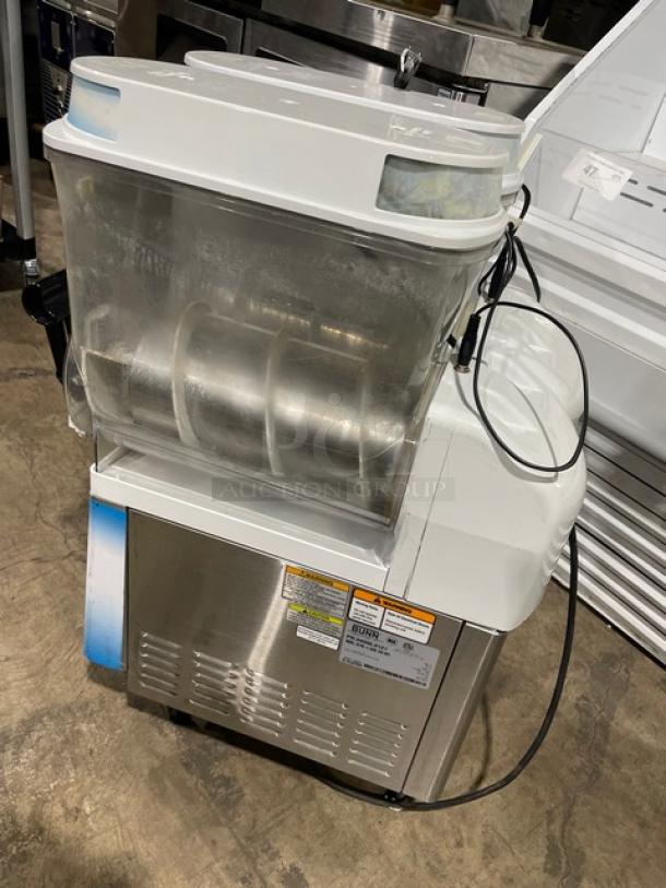 Bunn Ultra-2 commercial frozen beverage machine, white stainless steel, double tanks, electric-powered, with drip tray, on legs.