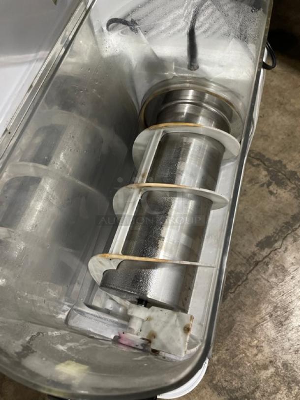 Bunn Ultra-2 commercial slush machine interior view, showing stainless steel augers and casing. Visible signs of wear.