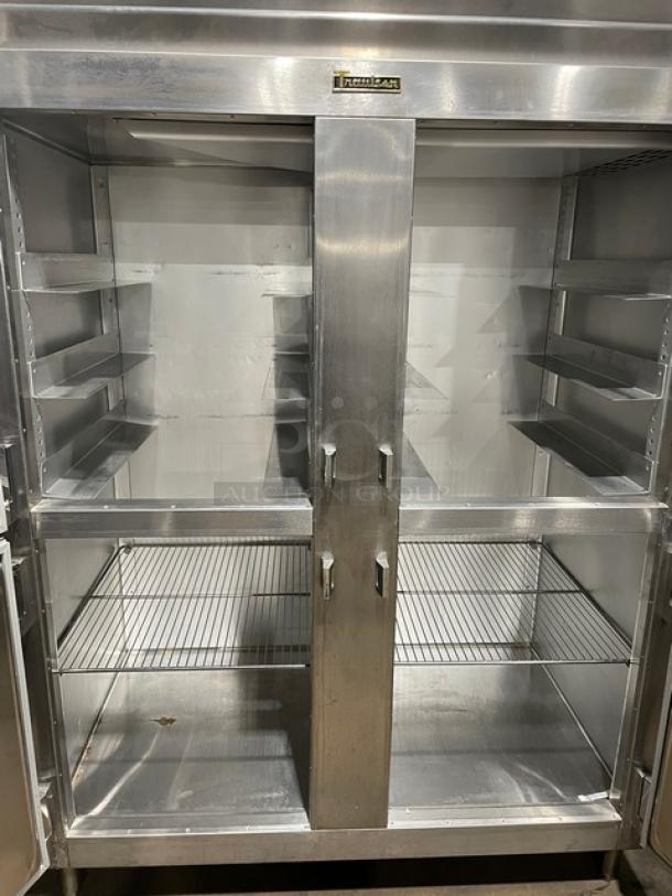 Traulsen Spec Line stainless steel refrigerator, model AHT232WUTHHS. Features four half doors, wire racks, and built-in pan slides.