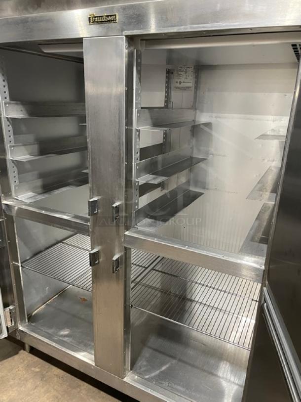 Traulsen Spec Line Series stainless steel reach-in refrigerator, model AHT232WUTHHS, with wire racks and pan slides, on legs.