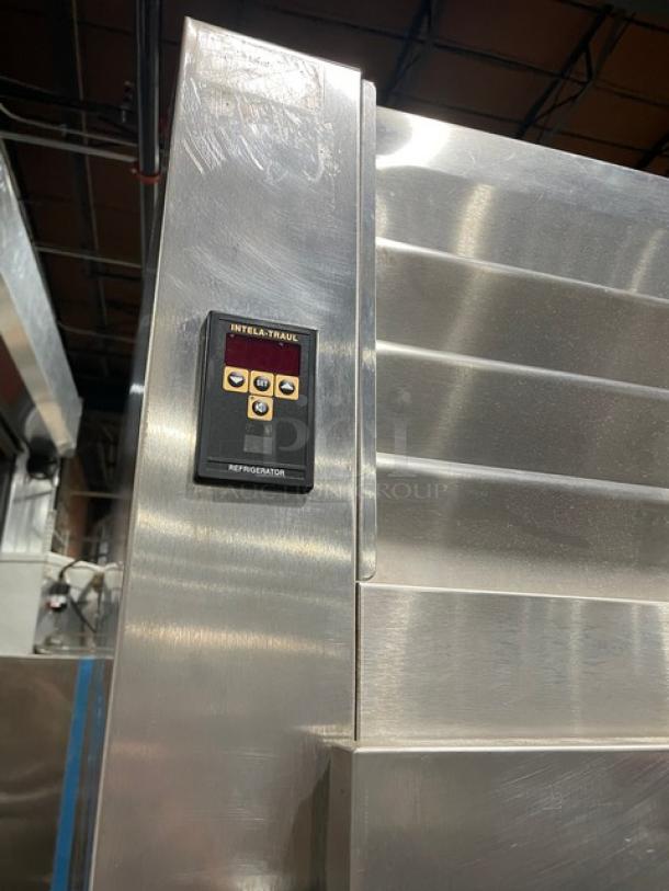 Traulsen Spec Line Series stainless steel refrigerator, model AHT232WUTHHS, with solid 4 half doors, wire racks, pan slides, on legs.