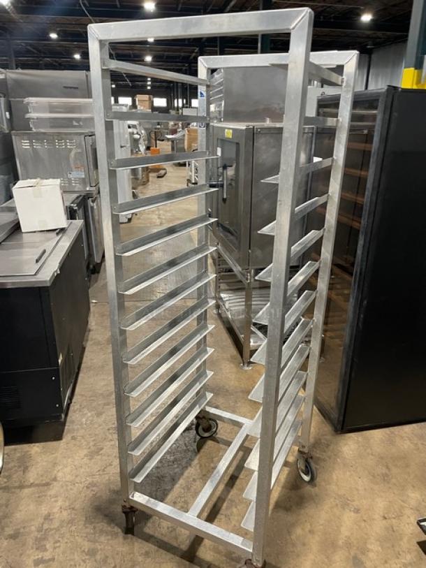 Alexander Industries heavy-duty commercial bun/sheet pan transport rack on casters, durable metal, used condition.
