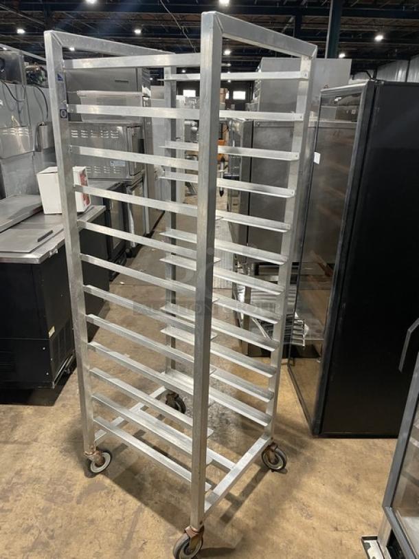 Alexander Industries heavy-duty bun/sheet pan rack on casters, holds multiple trays, durable metal frame, ideal for transport.