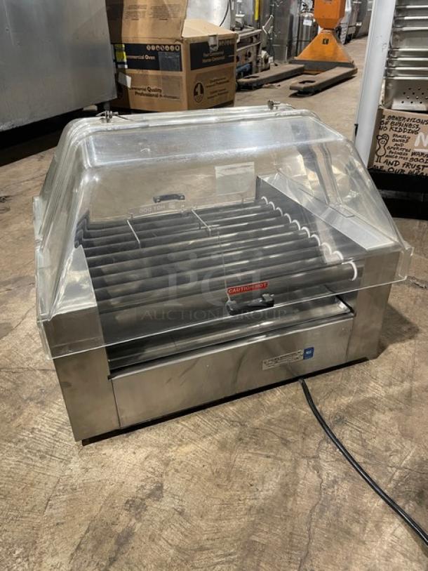 Star 258 stainless steel electric hot dog roller with clear cover. Model 258 SN: 25024209, 120V, on legs.
