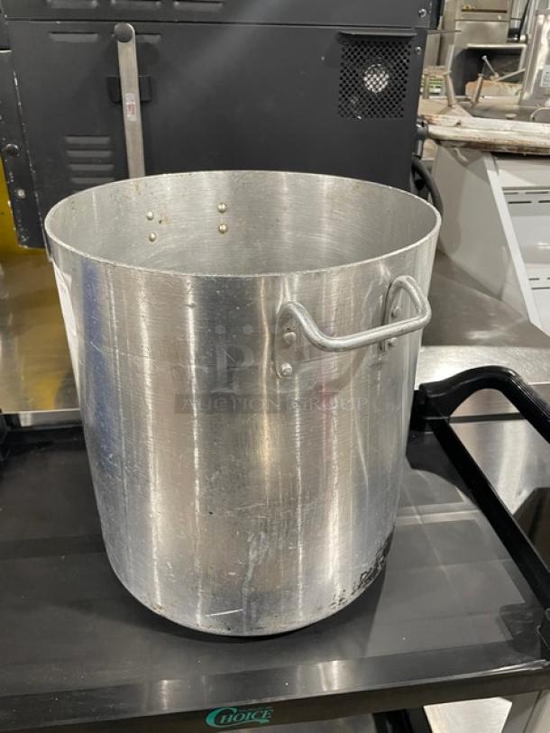 Commercial heavy-duty stock pot with dual handles, metallic finish, used condition, ideal for large-scale cooking.