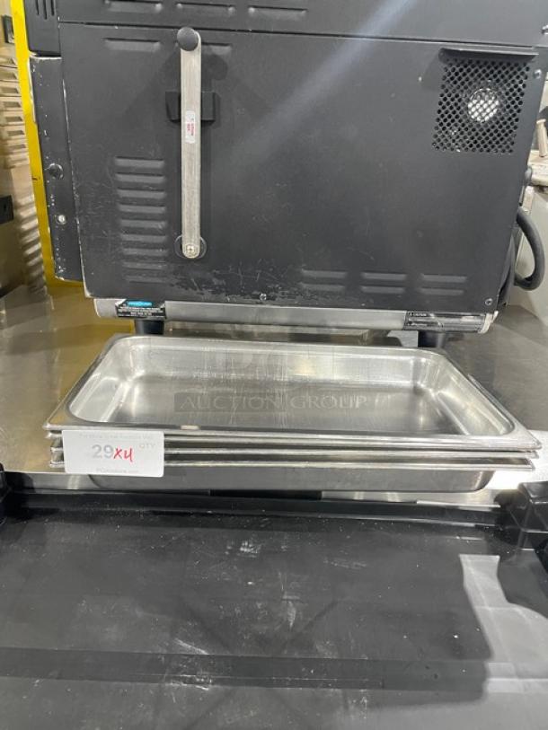 Stainless steel hotel steamtable pan, commercial-grade, sleek polished finish, excellent condition, includes "29X4" label.
