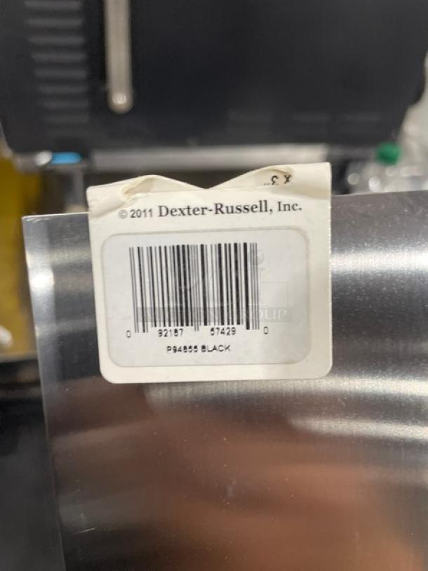 Dexter Russell stainless steel turner, model P94855, with black grip handle, brand new, original tag visible.