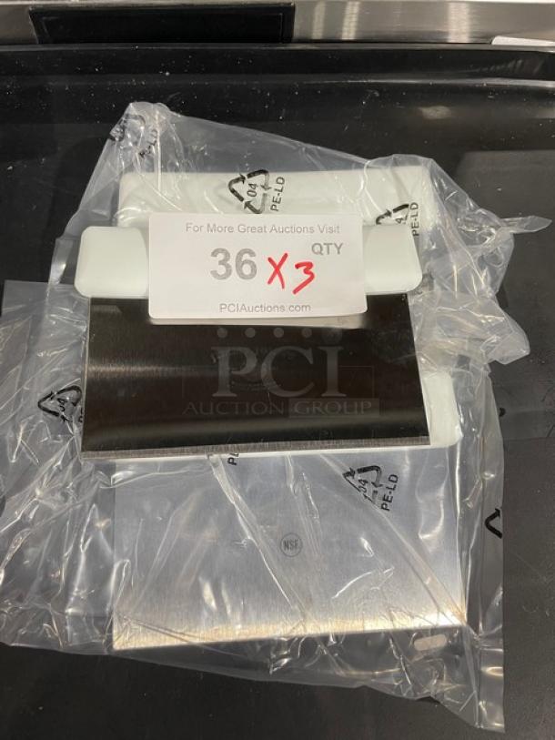 Brand new Jimmy John's commercial stainless steel dough cutter with white grip handle, still packaged. NSF marked.