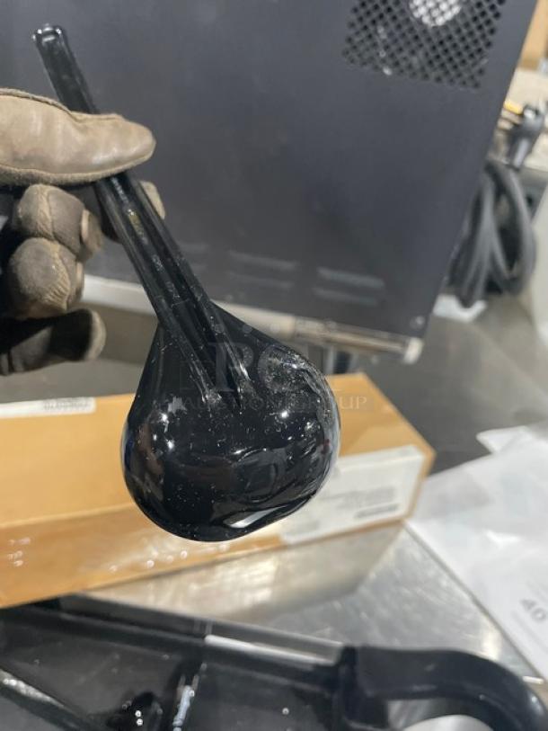 Brand new Carlisle black 9.5" lemon vinaigrette ladle, model 02955979, shown in packaging, 12 per case.