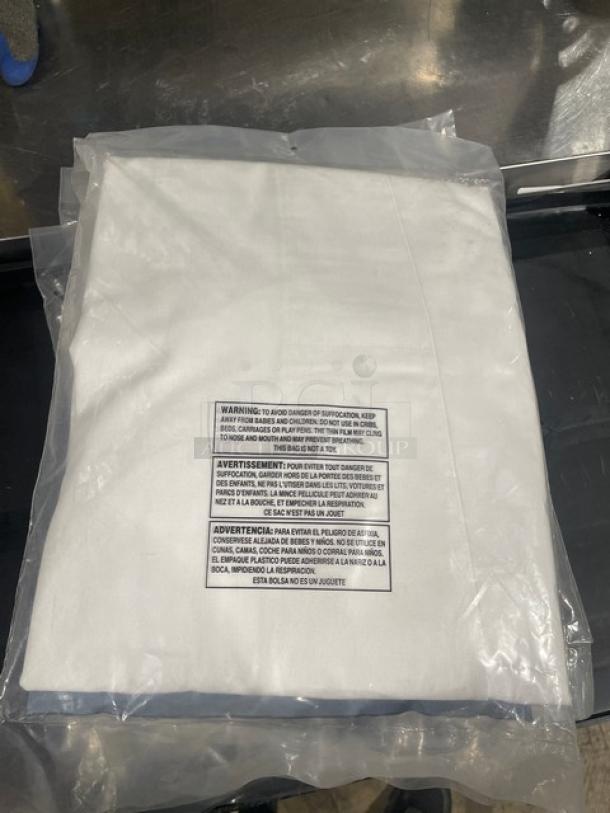 Brand new Chef Revival chef's tunic in packaging. Size 2XX. White color. Includes safety warning label.

