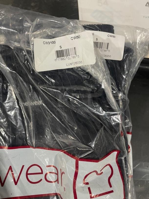 Brand new Chef Wear chef's pants in packaging, size small, model CW3100. Four pairs included.