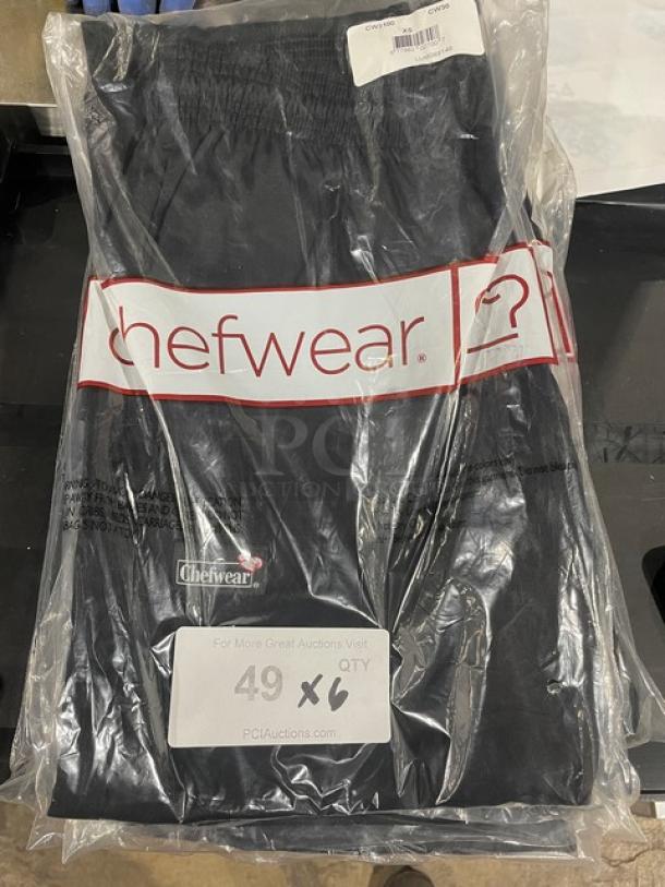 Brand new Chef Wear XS chef pants in packaging, labeled for auction quantity 6X, item appears in excellent condition.