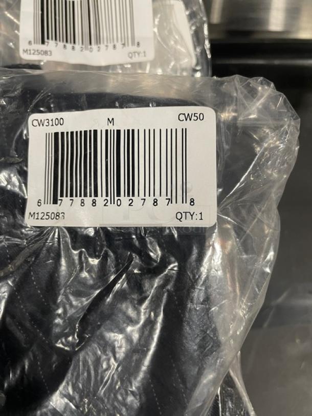 Brand new Chef Wear chef pants in size medium, packaged. Barcode label shows model CW3100, quantity 1.