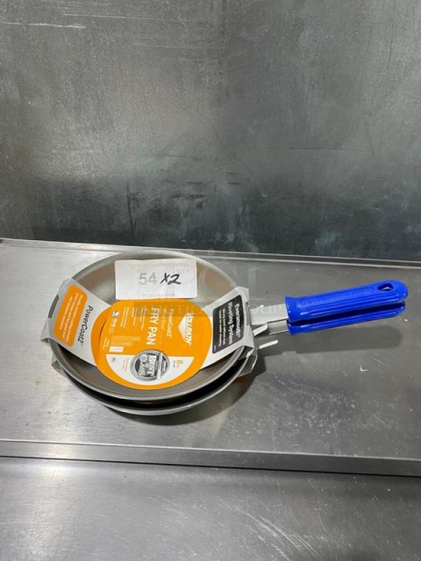 Brand new Vollrath Wear-Ever 8" round fry pan with Power Coat 2 and blue grip handle, shown with product label.