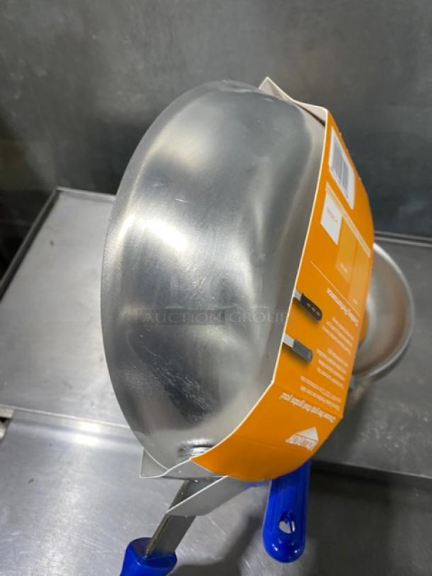 Brand new Vollrath Wear-Ever 8" aluminum fry pan, Powered Coat 2, blue grip handle, with packaging visible.
