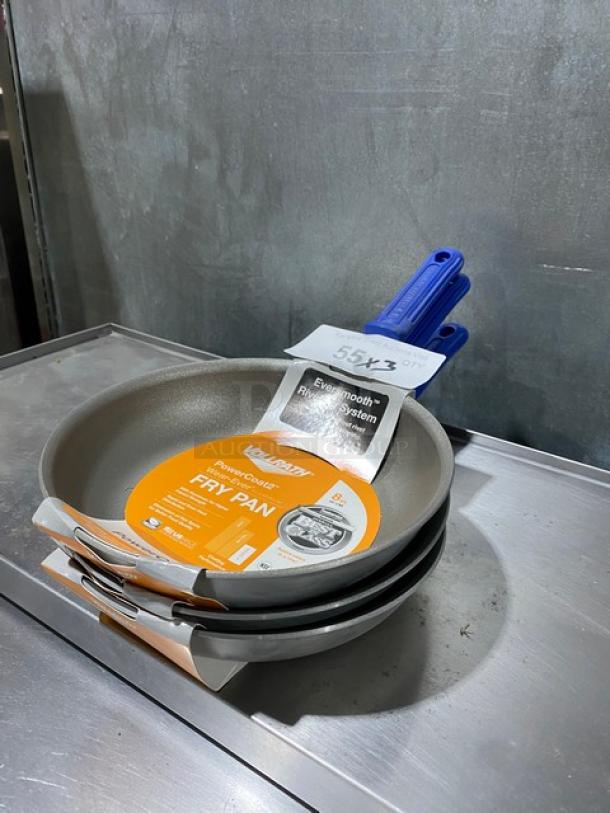 Brand new Vollrath Wear-Ever 8" round fry pan with Power Coat 2 and blue grip handle, shown with tags.
