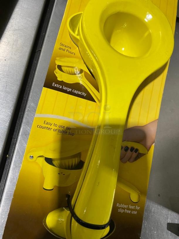 TableCraft V119 yellow handheld citrus juicer, brand new, extra large capacity, slip-free rubber feet, easy on counter use.