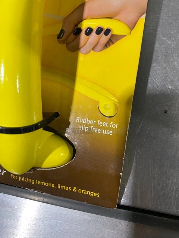 Brand new TableCraft V119 handheld yellow citrus juicer with rubber feet for slip-free use. Ideal for juicing lemons, limes, and oranges.