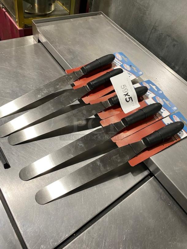 Brand new Winco TKPS-9 stainless steel bakery spatulas with black grip handles, displayed on metal surface.