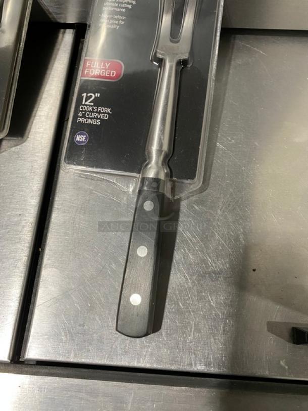 Winco Acero Series 12" stainless steel cook fork, model KFP-121, with black grip handle, fully forged, brand new in packaging.