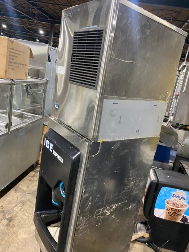 Hoshizaki stainless steel ice maker/dispenser combo, model KM-340MAH/DB-130H, with push button control, on legs, used condition.