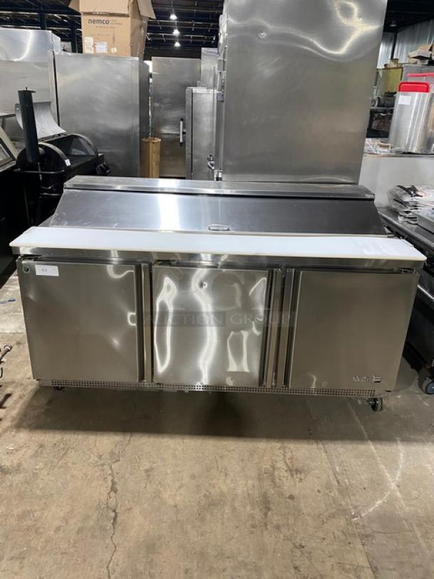 Asber APTS-72-18-HC 3-door stainless steel refrigerated prep table with cutting board, wire racks, casters; excellent condition.