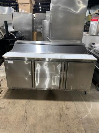 Asber APTS-72-18-HC 3-door stainless steel refrigerated prep table with cutting board, wire racks, casters; excellent condition.