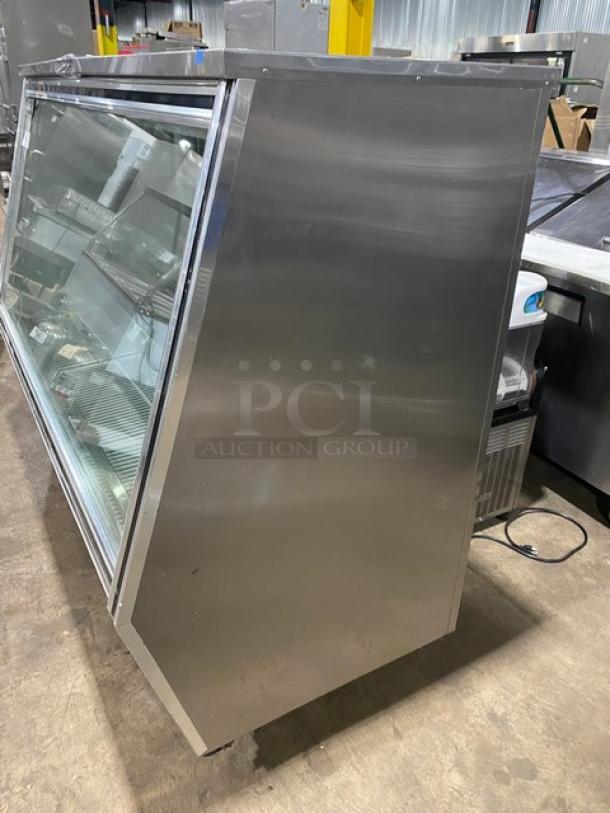 Leader 2017 commercial stainless steel 72" refrigerated deli display case, model HDL72FSC, with slanted glass, adjustable shelving, and sliding doors.
