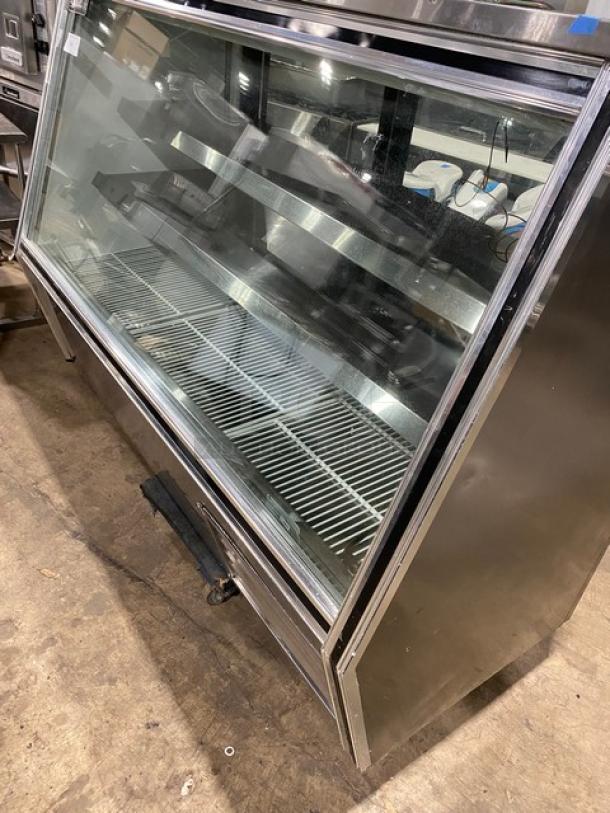 Leader HDL72FSC refrigerated deli/seafood merchandiser with slanted glass, adjustable shelving, sliding glass doors, and under storage.