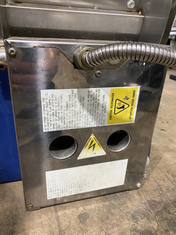 Electrolux Model HSPPA1 high-speed panini press grill, stainless steel, 2015, on legs. Labels show safety and voltage info.
