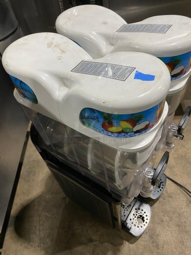 Icetro SSM-280 stainless steel slushy machine with twin clear polycarbonate hoppers and drip tray, 115V, gently used.