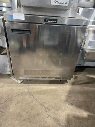 Delfield stainless steel under-counter refrigerator, single door, poly-coated rack, on casters, in good condition.