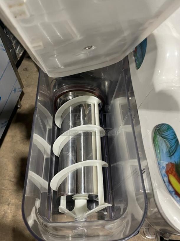 Icetro SSM280 stainless steel twin slushy machine with clear polycarbonate hoppers and drip tray, 115V electric.