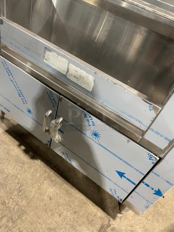 Infinity ICS-36-P10-CB-M stainless steel underbar ice bin/cocktail station with double speed rail, protective film partially visible, on legs.