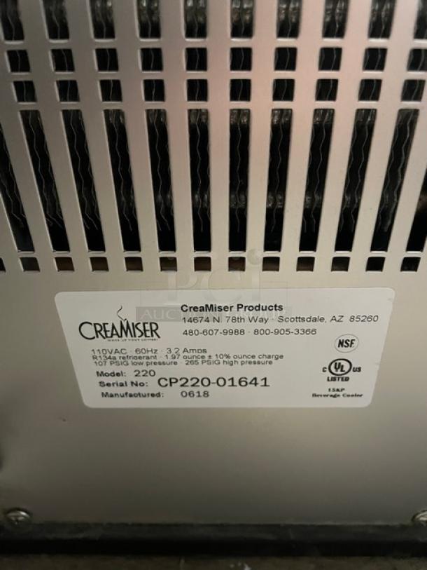 Creamiser Model 220 iced coffee dispenser label, indicating 110V power, serial number CP220-016441, and manufacture date 0618.