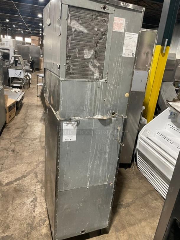 Hoshizaki commercial ice machine and dispenser, stainless steel, model 30H KM-32MAH/DB-1, electric, air-cooled, worn exterior, 115V.