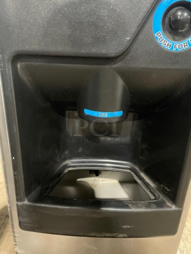 Hoshizaki stainless steel ice maker and dispenser, model 30H KM-32MAH/DB-1, with push button control, good condition.