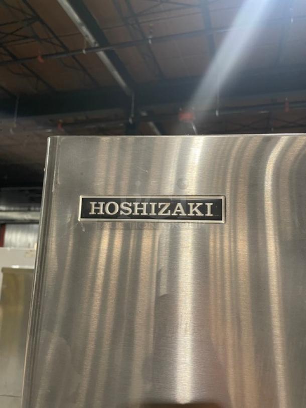 Hoshizaki stainless steel ice maker and dispenser, model 30H KM-32MAH/DB-1, featuring push button control. Visible Hoshizaki logo.