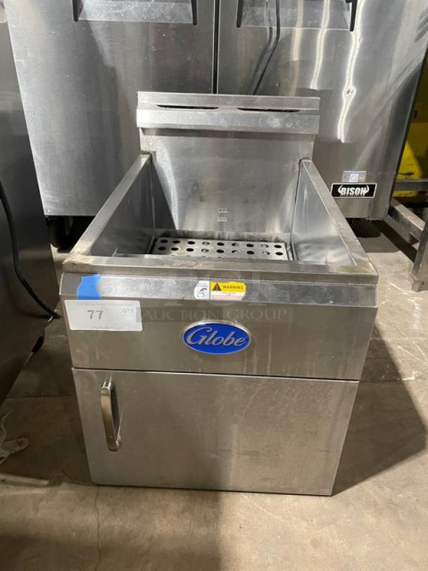 Globe commercial stainless steel gas countertop deep fat fryer with backsplash, basket hanger, visible brand logo.