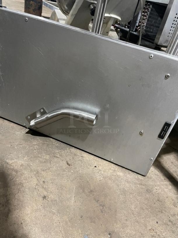 Globe commercial stainless steel countertop deep fat fryer with backsplash and basket hanger. Durable natural gas power.