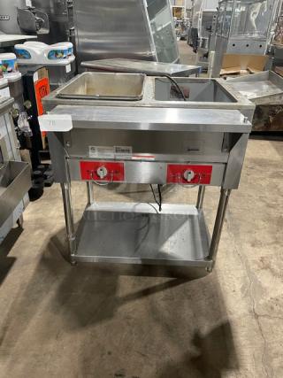 Omcan 2019 commercial stainless steel 2-bay hot food/steam table, model FZ-06B1, with single undershelf, on legs.