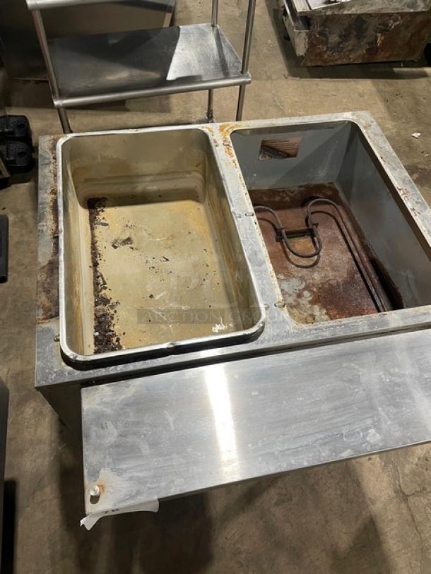 Omcan 2019 stainless steel 2 bay hot food/steam table, model FZ-06B1, single undershelf, visible wear and rust, on legs.