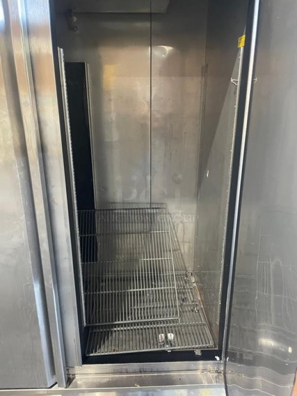Asber 2021 commercial stainless steel 2-door freezer, model ARF49, on casters, interior shelving, serial 81002342948.